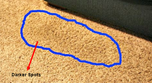 darker spots on carpets