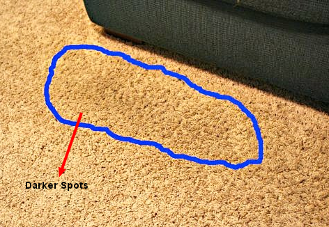 darker spots on carpets
